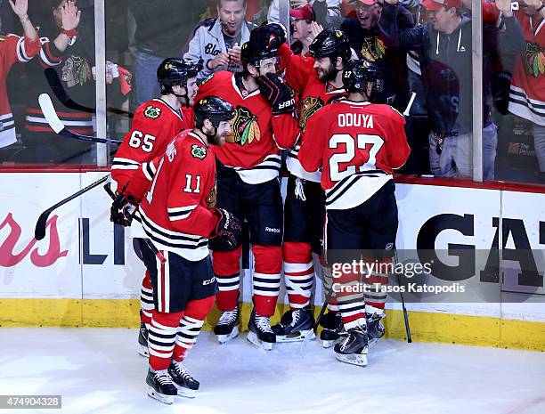 Andrew Shaw of the Chicago Blackhawks celebrates with teammates after scoring a third period goal against the Anaheim Ducks in Game Six of the...