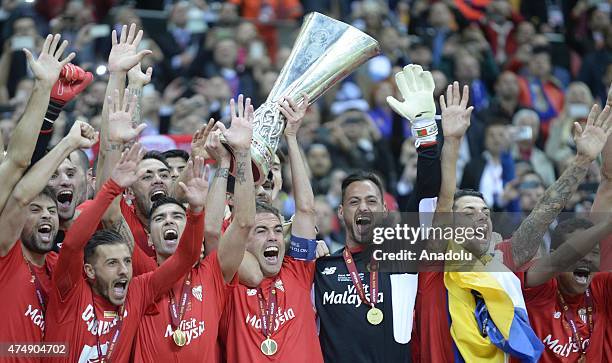 Members of Sevilla celebrate their victory as they won UEFA Europa League trophy after the UEFA Europa League Final match between FC Dnipro...