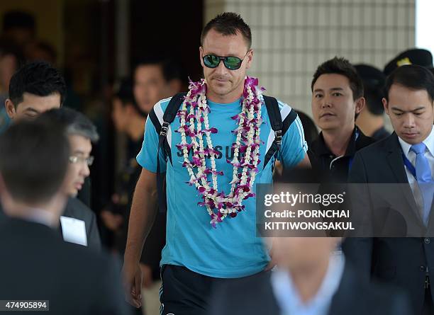 Chelsea football player John Terry arrives with the team at Don Muang Airport in Bangkok on May 28, 2015. The Blues will meet Thailand's All Stars at...