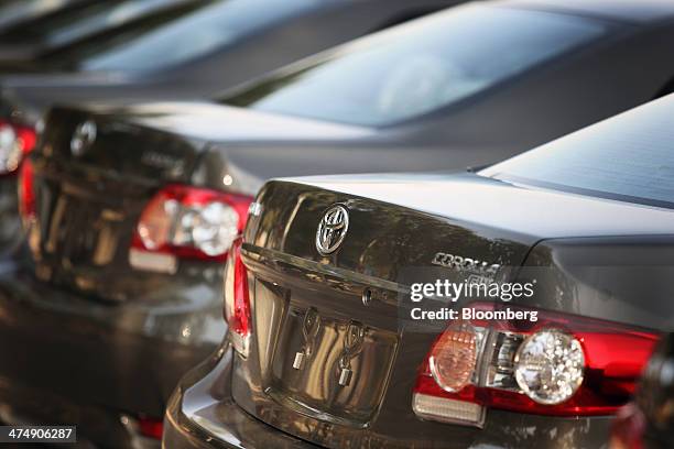 Totota Motor Corp. Badge sits on the rear of a Toyota Corolla GLi automobile assembled at the company's Pakistan affiliate Indus Motor Co.'s plant in...