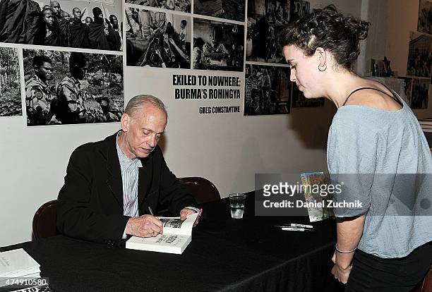 John Waters meets with fans during the book launch party for his book "Carsick" at PowerHouse Arena on May 27, 2015 in New York City.