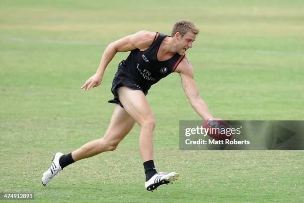 Ben Reid marks the ball during a Collingwood Magpies AFL training session at the Southport Football Club on February 26, 2014 on the Gold Coast,...