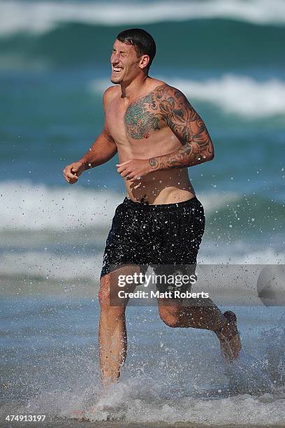 Jesse White runs out of the water during a Collingwood Magpies AFL beach session at the Southport Spit on February 26, 2014 on the Gold Coast,...