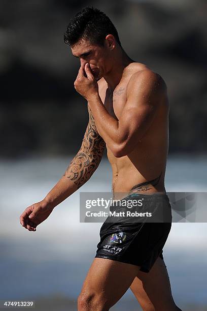 Marley Williams walks out of the water during a Collingwood Magpies AFL beach session at the Southport Spit on February 26, 2014 on the Gold Coast,...