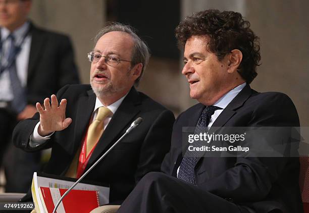 Steven Kamin , Director of International Finance at the U.S. Federal Reserve, and Harvard University professor Alberto Alesina attend a symposium...