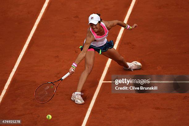 Silvia Soler-Espinosa of Spain stretches in her Women's Singles match against Petra Kvitova of Czech Republic on day five of the 2015 French Open at...