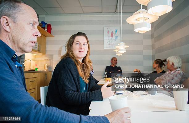 Workers at the Swedish Handball Federation meet for a traditional 'Fika', Swedish type of coffee break, on May 27, 2015 in Stockholm, Sweden. AFP...