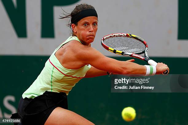 Lourdes Dominguez Lino of Spain returns a shot during her women's singles match against Andrea Petkovic of Germany on day five of the 2015 French...