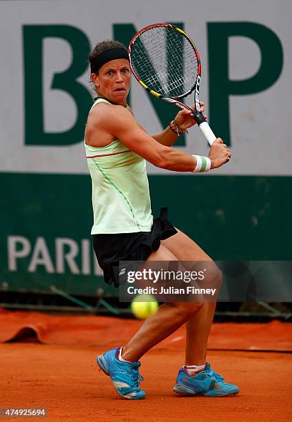 Lourdes Dominguez Lino of Spain returns a shot during her women's singles match against Andrea Petkovic of Germany on day five of the 2015 French...