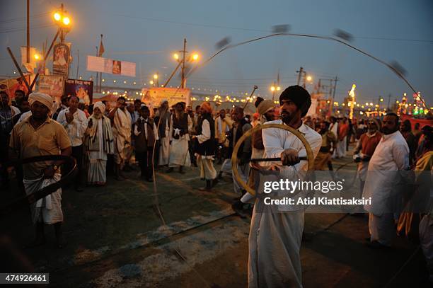 Indian men perform a traditional play at the Kumbh Mela grounds in the evening.