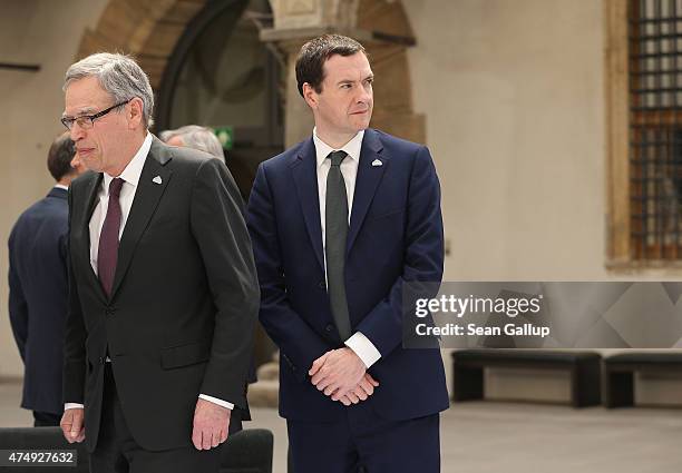 Canadian Minister of Finance Joe Oliver and British Chancellor of the Exchequer George Osborne arrive the group photo of finance ministers, central...