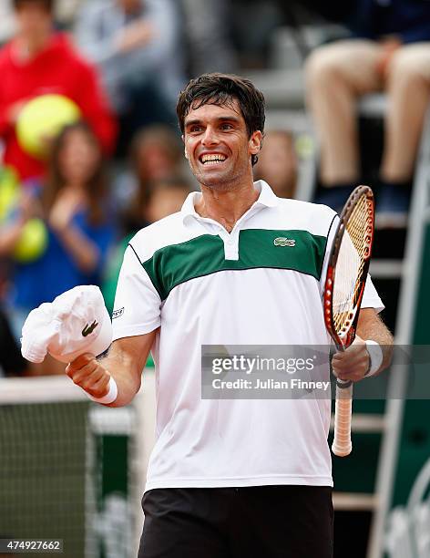 Pablo Andujar of Spain celebrates victory in his men's singles match against Philipp Kohlschreiber of Germany on day five of the 2015 French Open at...