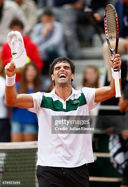 Pablo Andujar of Spain celebrates victory in his men's singles match against Philipp Kohlschreiber of Germany on day five of the 2015 French Open at...