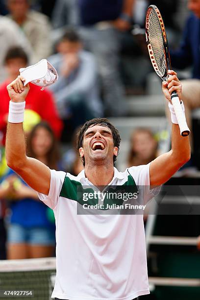 Pablo Andujar of Spain celebrates victory in his men's singles match against Philipp Kohlschreiber of Germany on day five of the 2015 French Open at...