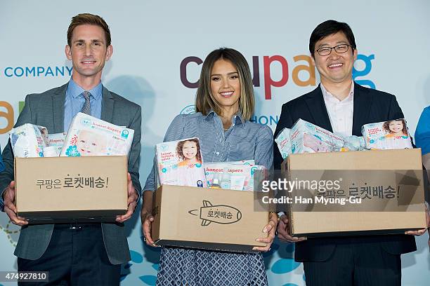Christopher Gavigan, CPO of The Honest Company, Jessica Alba and Bom Kim, CEO of Coupang pose for media during the press conference for E-commerce...