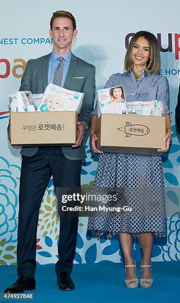 Christopher Gavigan, CPO of The Honest Company and Jessica Alba pose for media during the press conference for E-commerce company "COUPANG" at the...