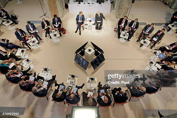 Finance ministers, central bank governors and global financial institution heads attend a symposium during a meeting of finance ministers of the G7...