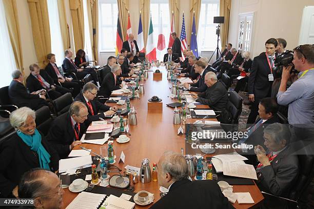 Finance ministers, central bank governors and global financial institution heads attend a working session during a meeting of finance ministers of...