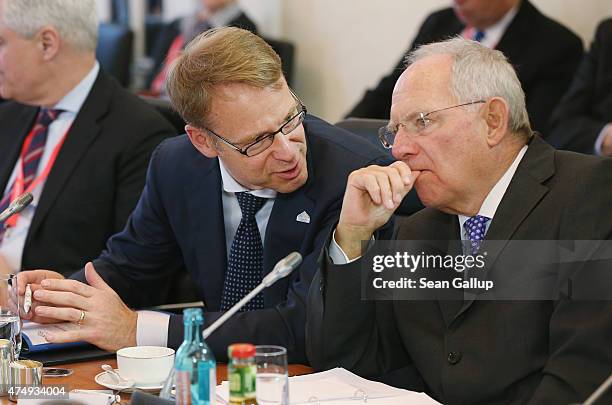 German Bundesbank Governor Jens Weidmann and German Finance Minister Wolfgang Schaeuble attend a working session during a meeting of finance...