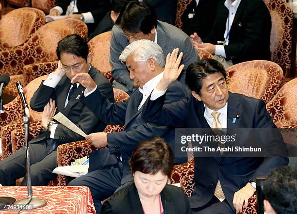 Japanese Prime Minister Shinzo Abe responds to the question by Democratic Party lawmaker Kiyomi Tsujimoto during a special committee to deliberate...