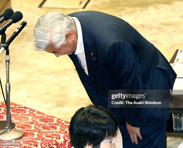 Japanese Defense Minister Gen Nakatani bows during a special committee to deliberate the 11 security bills at the lower house of the diet on May 28,...