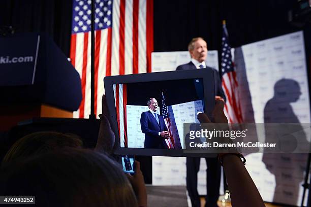 Former New York Gov. George Pataki is seen on a tablet screen during an interview prior to announcing his candidacy for the 2016 Republican...