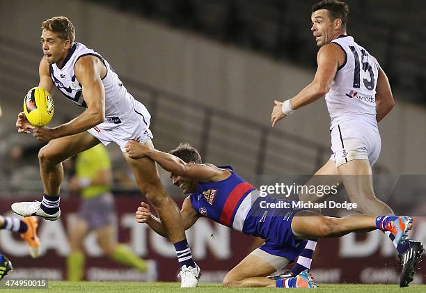 Shaun Higgins of the Bulldogs tackles Stephen Hill of the Dockers during the round three AFL NAB Challenge match between the Western Bulldogs and the...
