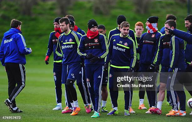 Sunderland player Adam Johnson and team mates look on during Sunderland training ahead of sunday's Capital One Cup Final against Manchester City, at...