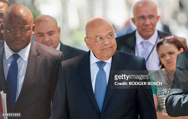 South African Minister of Finance Pravin Gordhan arrives at the South African Parliament to deliver the 2014 Budget speech, on February 26 in Cape...