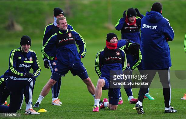 Sunderland manager Gus Poyet shares a joke with his players during Sunderland training ahead of sunday's Capital One Cup Final against Manchester...