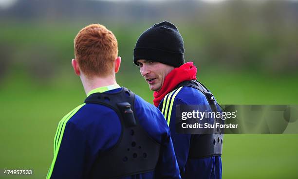 Sunderland player Adam Johnson chats with Jack Colback during Sunderland training ahead of sunday's Capital One Cup Final against Manchester City, at...