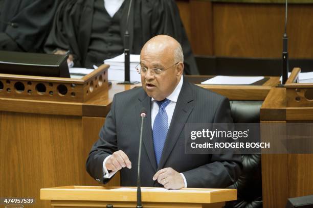 South African Minister of Finance Pravin Gordhan delivers the 2014 Budget speech at the South African Parliament, on February 26 in Cape Town. South...