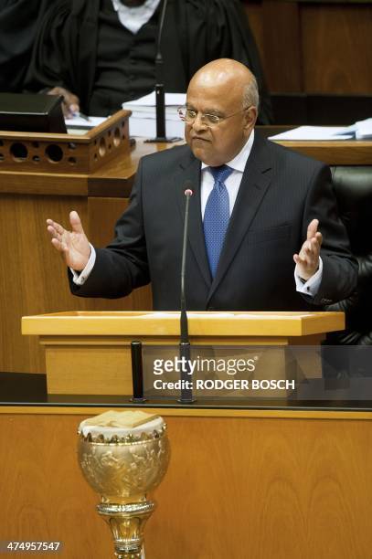 South African Minister of Finance Pravin Gordhan delivers the 2014 Budget speech at the South African Parliament, on February 26 in Cape Town. South...