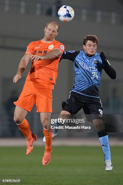 Zlatan Muslimovic of Guizhou Renhe and Paulinho of Kawasaki Frontale compete for the ball during the AFC Champions League Group H match between...