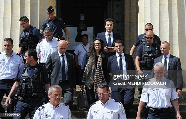 Françoise Bettencourt-Meyers , daughter of France's richest woman Liliane Bettencourt, flanked by her sons Nicolas and Jean-Victor , leaves on May...