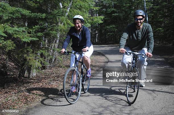 Omar Khadr, right, goes for his first bike ride on May 9 since being freed with Patricia Edney, who along with her husband Dennis has offered the...