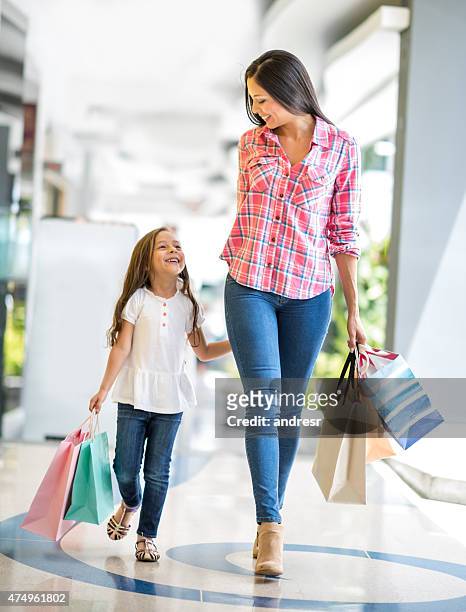 happy mother and daughter shopping - latin american and hispanic shopping bags stock pictures, royalty-free photos & images