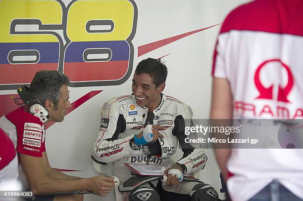 Yonny Hernandez of Colombia and Pramac Racing speaks with mechanics during the MotoGP Tests in Sepang - Day One at Sepang Circuit on February 26,...