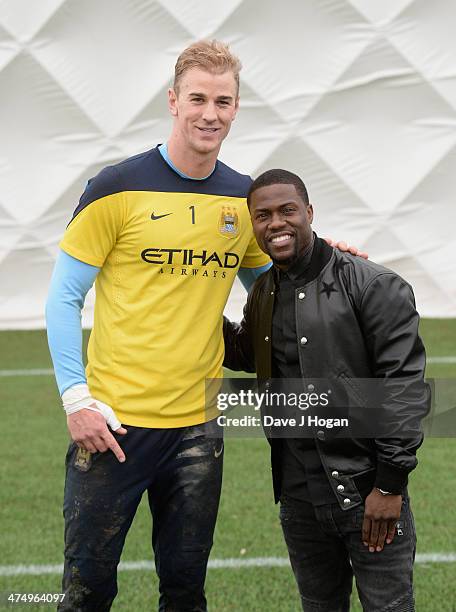 Kevin Hart, star of "Ride Along" makes a visit to the Manchester City FC training ground at Carrington where he met Joe Hart on February 26, 2014 in...