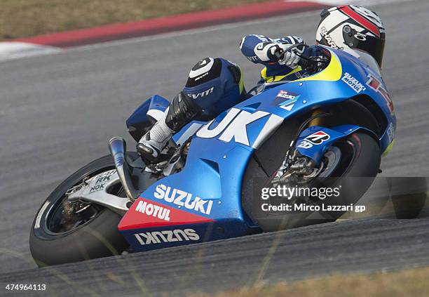 Randy De Puniet of France and Suzuki Test Team rounds the bend during the MotoGP Tests in Sepang - Day One at Sepang Circuit on February 26, 2014 in...