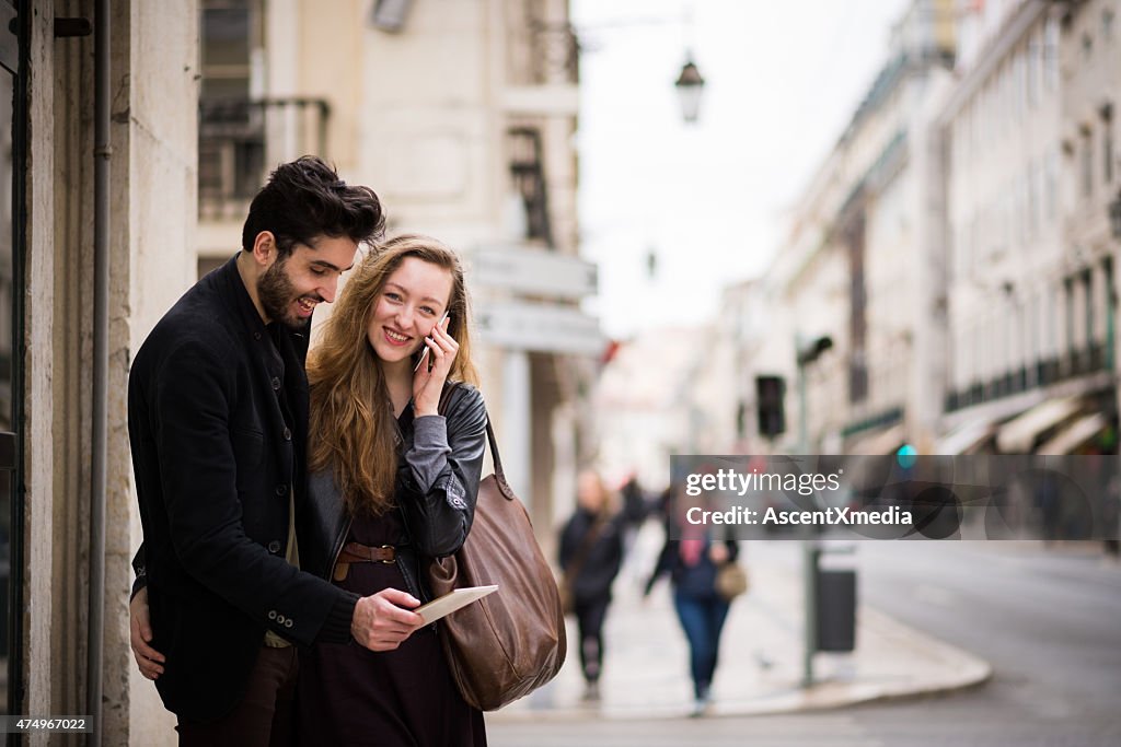 Couple using a digital tablet and smart phone