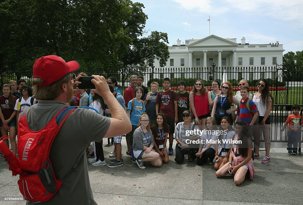 Tourists Gather In Front Of White House While Touring DC's Sites