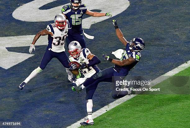 Malcolm Dutler of the New England Patriots intercepts the pass at the goal line late in the fourth quarter against the Seattle Seahawks during Super...