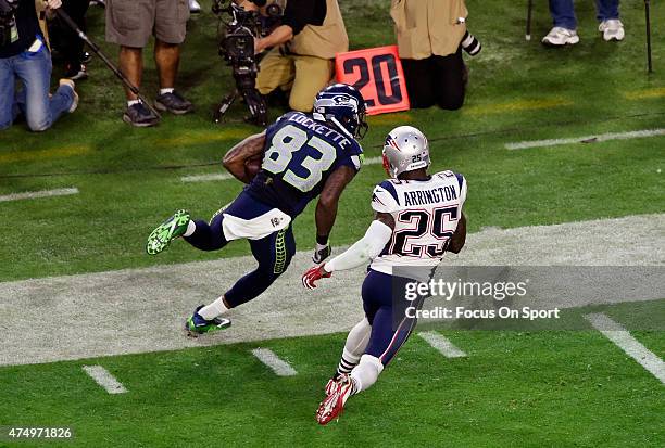 Ricardo Lockette of the Seattle Seahawks runs with the ball after catch pursued by Kyle Arrington of the New England Patriots during Super Bowl XLIX...