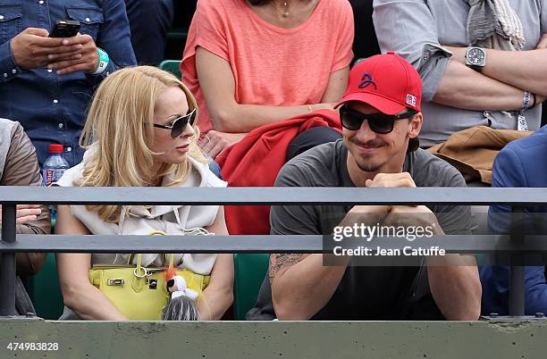 Zlatan Ibrahimovic of PSG and his wife Helena Seger cheer for their friend Novak Djokovic of Serbia during his match against Gilles Muller of...