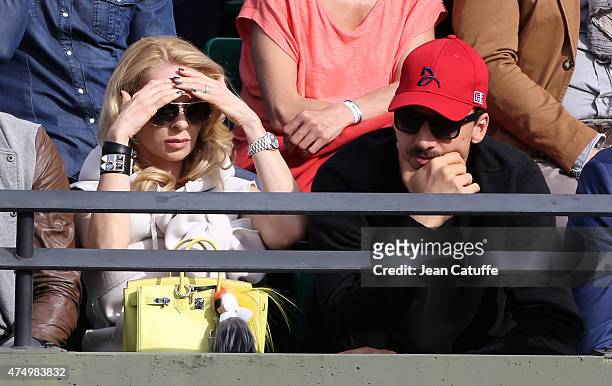 Zlatan Ibrahimovic of PSG and his wife Helena Seger cheer for their friend Novak Djokovic of Serbia during his match against Gilles Muller of...