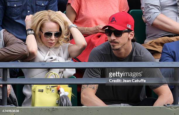 Zlatan Ibrahimovic of PSG and his wife Helena Seger cheer for their friend Novak Djokovic of Serbia during his match against Gilles Muller of...