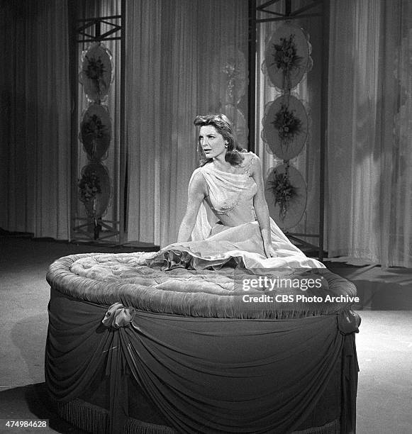 Julie London performs on the CHRYSLER SHOWER OF STARS. Image dated April 28, 1957.