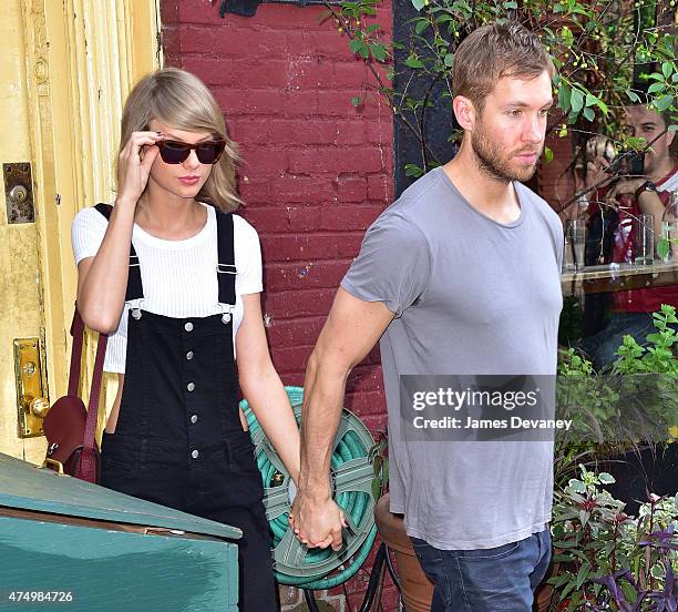 Taylor Swift and Calvin Harris leave the Spotted Pig restaurant on May 28, 2015 in New York City.