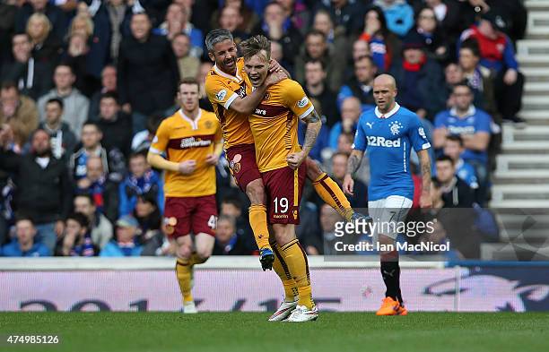 Josh Law of Motherwell is congratulated on his goal by Keith Lasley during the Scottish Premiership play off final, first leg match between Rangers...